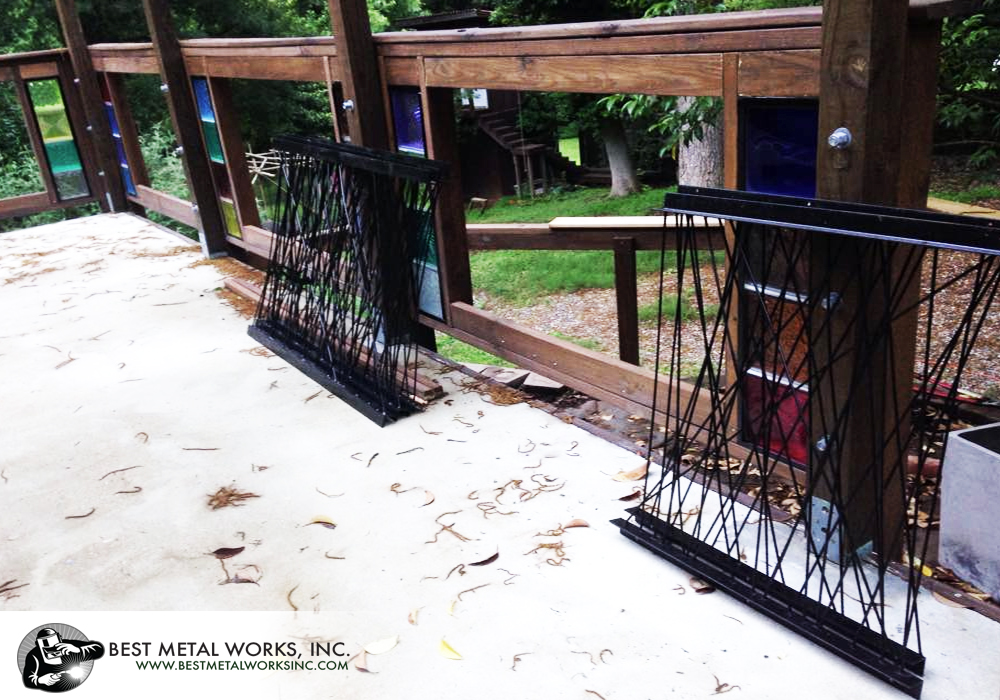 Custom patio railings of rod steel and angle iron.
